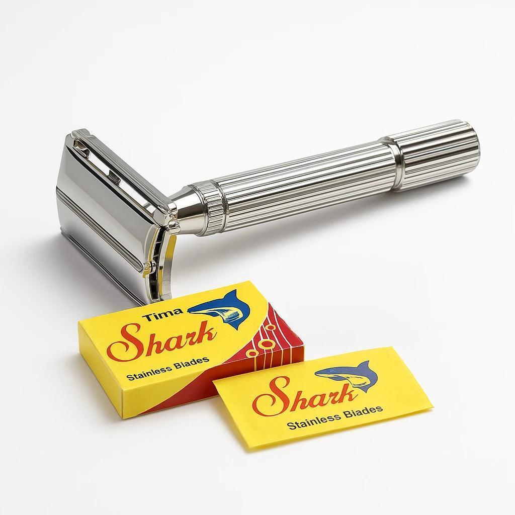 Silver safety razor with Tima Shark branded blades on a white background