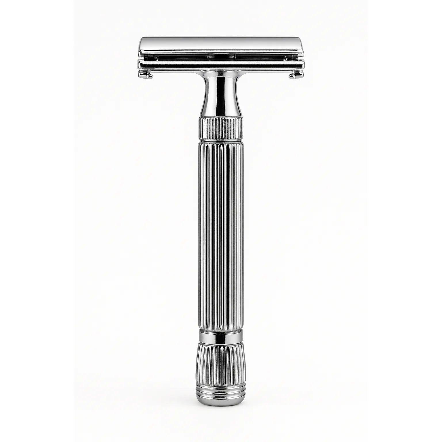 Silver safety razor on a white background